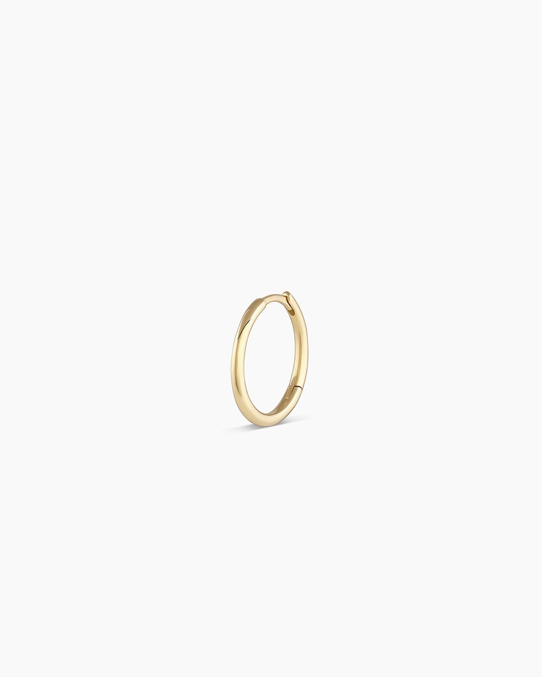 Woman wearing Classic Gold Huggie || option::14k Solid Gold, 13mm